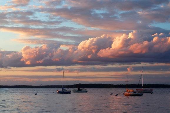 Boats on the water at sunset on Lake Mendota, Wisconsin