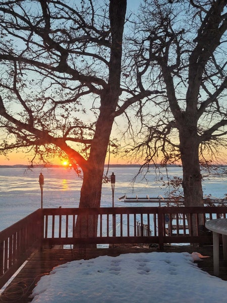 Sunset over the lake in the winter from a Lake Waubesa waterfront home